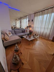 Posezení v ubytování Appartement Paris 12 proche du centre avec parking + 19 fotografií