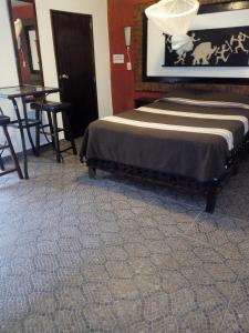 Un ou plusieurs lits dans un hébergement de l'établissement Hotel boutique Teocalli