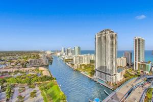 an aerial view of a city with a river and buildings at Penthouse Sky Suite - 2BDR2BTH - Private Rooftop Terrace in Hallandale Beach