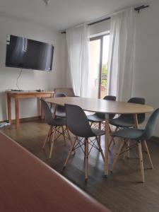 a dining room with a table and chairs at Depto doble cerca del Centro in Talca