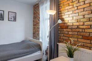 Łóżko lub łóżka w pokoju w obiekcie Stay99 Apart