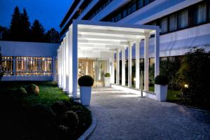 a hallway of a building at night at Living Place Hotel in Villanova