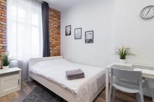 Łóżko lub łóżka w pokoju w obiekcie Stay99 Apart