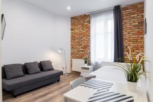 Łóżko lub łóżka w pokoju w obiekcie Stay99 Apart