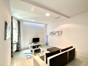 Telewizja i/lub zestaw kina domowego w obiekcie Stay99 Apart