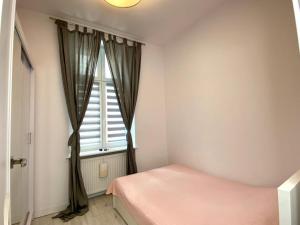 Łóżko lub łóżka w pokoju w obiekcie Stay99 Apart