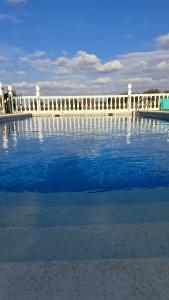a large body of water with a bridge in the background at Casa Albahacar in Paymogo