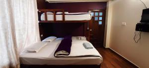 a room with two bunk beds in a room at A La Maison in Shillong