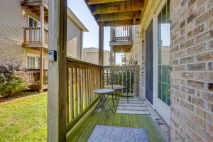 a porch with a table and a chair on it at 3 Mi to WVU Condo with Deck in Morgantown in Morgantown