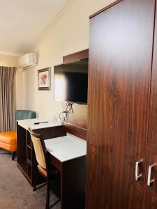 TV a/nebo společenská místnost v ubytování Auckland Airport Kiwi Motel