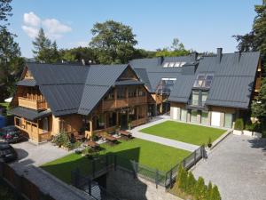 an aerial view of a house with a roof at Stefanova Zakopane Aparthotel & Spa in Zakopane