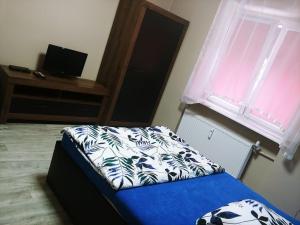 Posteľ alebo postele v izbe v ubytovaní Mazur