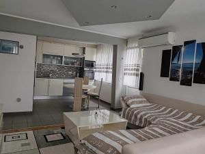a living room with a couch and a table at TINA in Karlovac