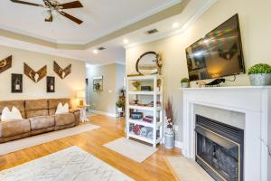 a living room with a couch and a fireplace at Georgia Countryside Home 3 Mi to Wild Adventures! in Briggston