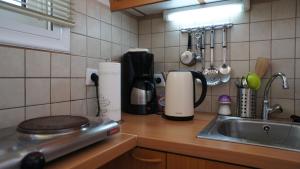 A kitchen or kitchenette at Idi