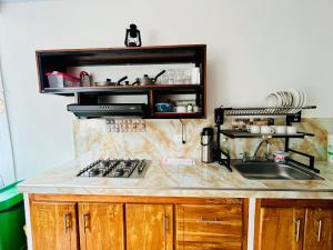 Kuchyň nebo kuchyňský kout v ubytování Cabaña Santorini Colombiano