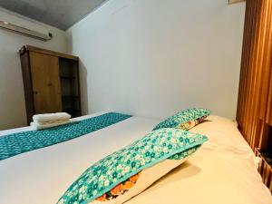 Postel nebo postele na pokoji v ubytování Cabaña Santorini Colombiano