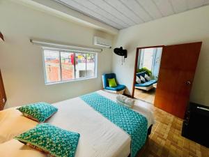 Postel nebo postele na pokoji v ubytování Cabaña Santorini Colombiano