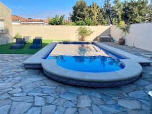 Bazén v ubytování El Rincon de Piedra - Tu Hogar En Vacaciones nebo v jeho okolí