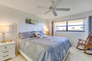 a bedroom with a bed and a ceiling fan at 2 Mi to Fort Pierce Jetty Coastal Florida Condo in Fort Pierce +23 photos