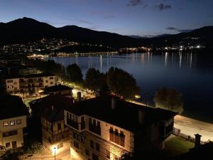 a view of a large body of water at night at Lakeview Balcony in Kastoria in Kastoria +31 photos