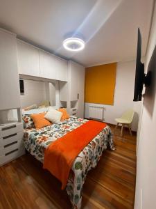 Ένα ή περισσότερα κρεβάτια σε δωμάτιο στο APARTAMENTO COSTA CANTABRIA