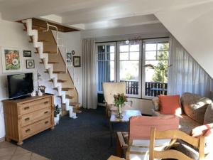 TV a/nebo společenská místnost v ubytování Ferienwohnung Nr 07 OG Spitzboden