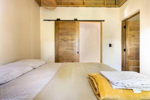 Letto o letti in una camera di Casa Latte