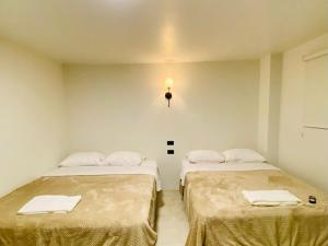 Letto o letti in una camera di Hotel Bombay