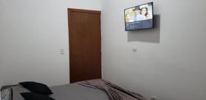 TV a/nebo společenská místnost v ubytování Pousadinha Villa di Marie