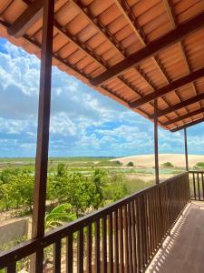 a balcony with a view of the desert at Pousada Ondas do Vento in Tatajuba