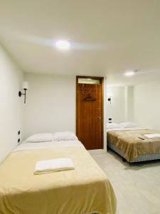 Letto o letti in una camera di Hotel Bombay
