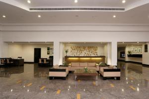 a living room with a couch and a table at Greenpark Visakhapatnam in Visakhapatnam