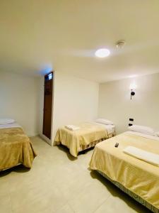Letto o letti in una camera di Hotel Bombay