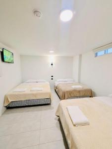 Letto o letti in una camera di Hotel Bombay