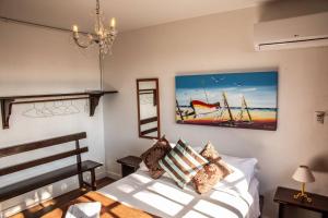 Giường trong phòng chung tại 3 - Apto com Jacuzzi e Vista Mar - Morada do Ganso