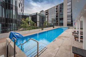 a swimming pool on the side of a building at Penthouse Apartment in Belconnen in Belconnen