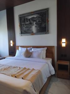 Postel nebo postele na pokoji v ubytování Sujiwa Ubud Hotel & Villa