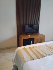 TV a/nebo společenská místnost v ubytování Sujiwa Ubud Hotel & Villa