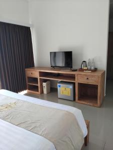 Postel nebo postele na pokoji v ubytování Sujiwa Ubud Hotel & Villa