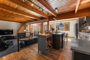 a large kitchen with wooden ceilings and wooden floors at Tennis Townhome 1337 : 2 in Keystone
