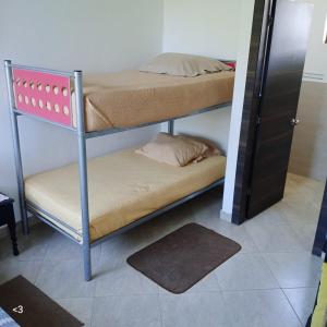 Postel nebo postele na pokoji v ubytování Casa vacacional en Pedro Vicente Maldonado + 7 fotografií