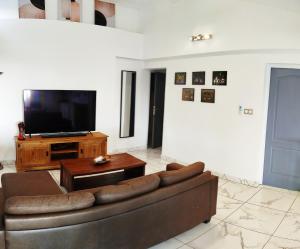 TV o dispositivi per l'intrattenimento presso Maison Les Cocotiers de Plaiz'Anse