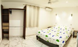 Letto o letti in una camera di Maison Les Cocotiers de Plaiz'Anse