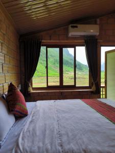 Postel nebo postele na pokoji v ubytování Xúa Vừ Homestay