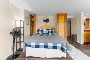 a bedroom with a bed and a fan at Decatur 1797 by Summit County Mountain Retreats in Keystone +45 photos