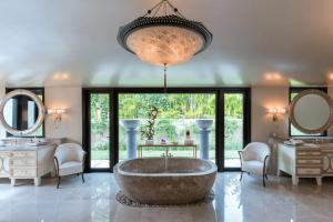 a large bathroom with a large tub and a large window at Luxury Villa in La Punta Estates, Enjoy 3,000 Usd Credit for Thanksgiving in Punta Mita