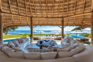 a living room with white couches and a pool at Luxury Villa in La Punta Estates, Enjoy 3,000 Usd Credit for Thanksgiving in Punta Mita