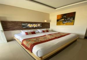 Postel nebo postele na pokoji v ubytování Batukaru Garden 5 Bali Sevilla Residence