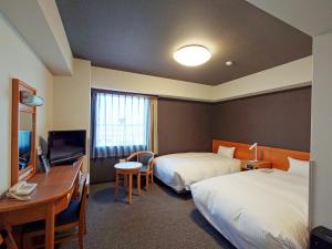 Katil atau katil-katil dalam bilik di Hotel Route-Inn Shibata Inter